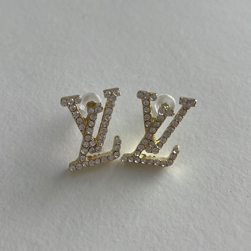 Louis Vuitton studs. Gold with small diamonds. Retails $600+ Can send with box